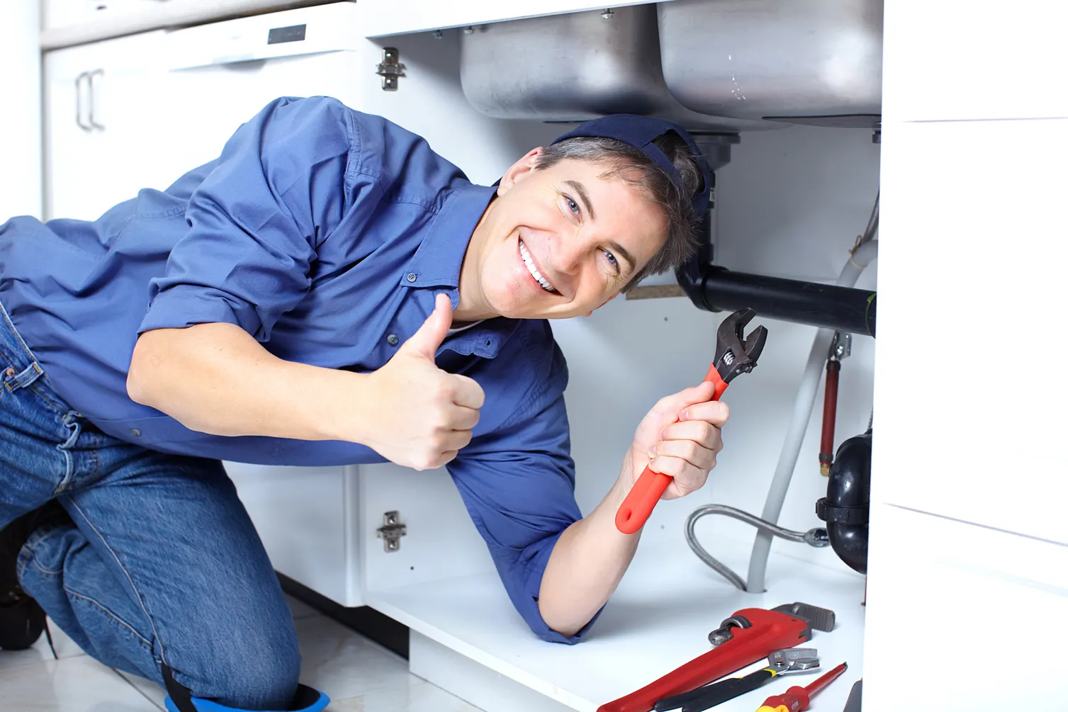 plumber fixing a drain problem